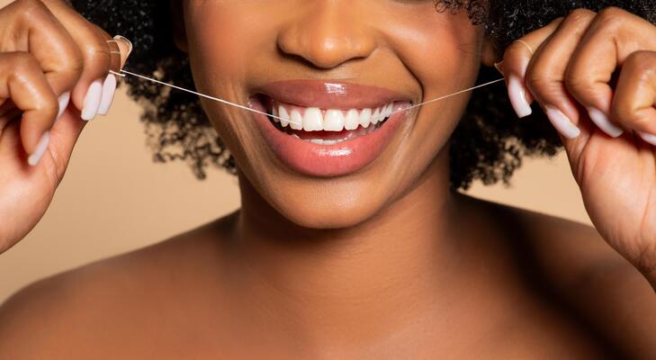 What Skipping the Floss Could Be Doing to Your Whole Body
