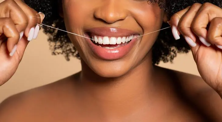 What Skipping the Floss Could Be Doing to Your Whole Body
